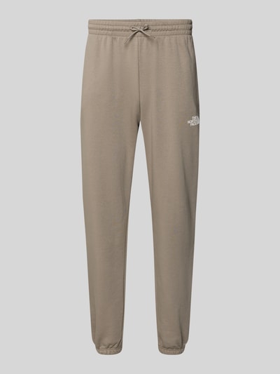Produktfoto, Sweatpants mit Logo-Print von The North Face in Beige, Baumwoll-Mix, Slim-Fit, Elastischer Bund mit Kordelzug, elastische Abschlüsse