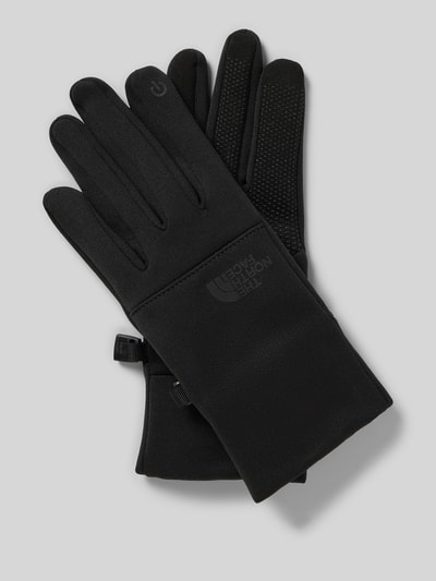 Produktfoto, schwarze Fingerhandschuhe mit Logo Modell 'ETIP' von The North Face, körpernahe Passform, glatte Textur, kontrastarme Optik