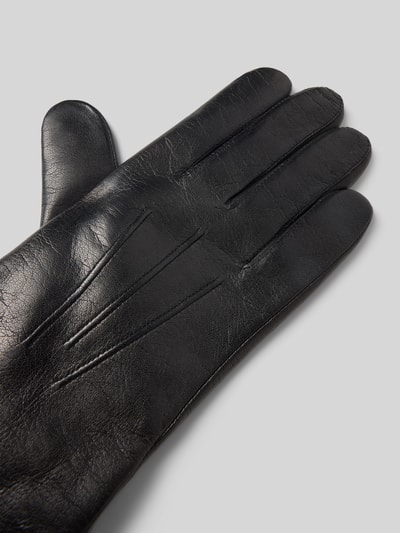 Produktfoto, Lederhandschuhe aus echtem Leder Modell 'Dover' von Roeckl, schwarzes Haarschaf Nappaleder, Kaschmir-Mix Innenfutter, klassische Aufnähte, Umbugsaum, metallic Label-Detail, glatte Textur, dezenter Glanz