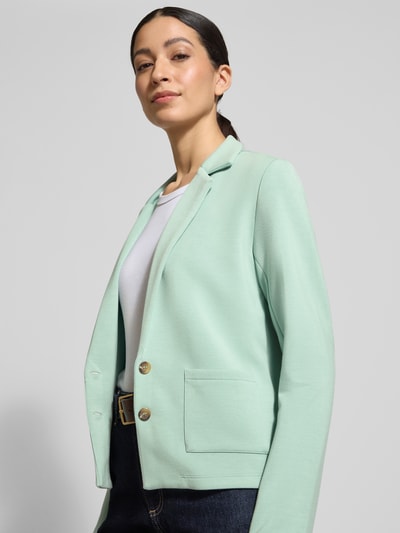 Vrouwenmodel draagt Sweatblazer met Taschen und Revers van Christian Berg Woman, regular fit in mint, zachte textuur, Nahaufnahme bovenlichaam.