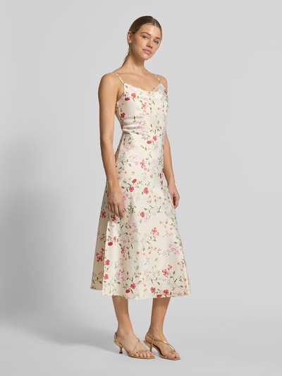 Kobiece modelka nosi Cocktailkleid mit Spaghettiträgern Modell 'THEA' od YAS, satynowa tkanina, prosty krój, długość midi, wzór allover, rozcięcie boczne, długość pleców w rozmiarze 36: 116 cm, szerokość w rozmiarze 36: 43 cm, jasne kolory, kwiatowy wzór, widok całej sylwetki z przodu.