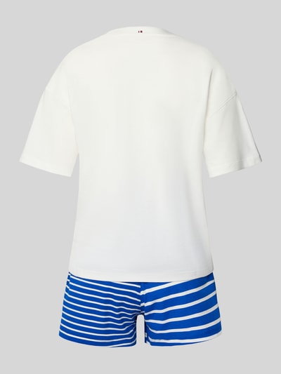 Frauenmodel trägt Regular Fit Pyjama aus reiner Baumwolle von TOMMY HILFIGER, Optik: Unifarben/Allover-Muster, Passform: Regular-Fit, Muster: Ohne/Streifen-Optik, Applikation: Logo-Applikation und Label-Print, Materialverarbeitung: Jersey, Material: Baumwolle-Mix, Ganzkörperansicht Rückansicht.