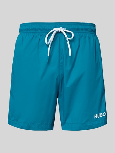 Produktfoto, spodenki kąpielowe Badeshorts mit Label-Print Modell 'HAITI' od HUGO, efekt: jednolity kolor, nadruk z logo, tunel, elastyczny ściągacz, wpuszczane kieszenie, kieszeń z tyłu