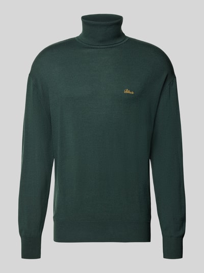 Produktfoto, dunkelgrüner Loose Fit Rollkragenpullover aus Woll-Mix von BLKVIS mit gerippten Abschlüssen, Label-Stitching auf Brust.