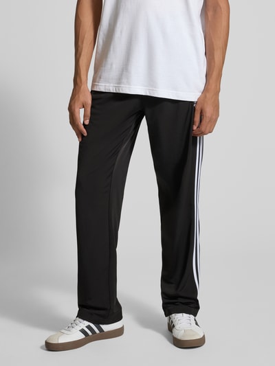 adidas Originals Spodnie treningowe z kieszeniami zapinanymi na zamek błyskawiczny model ‘FIREBIRD’ Czarny 4