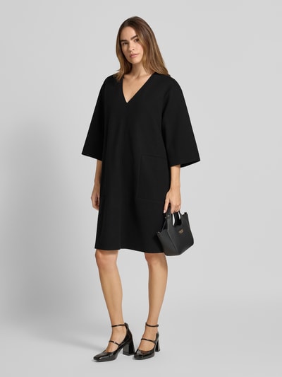 Christian Berg Woman Knielanges Kleid mit überschnittenen Schultern Black 1