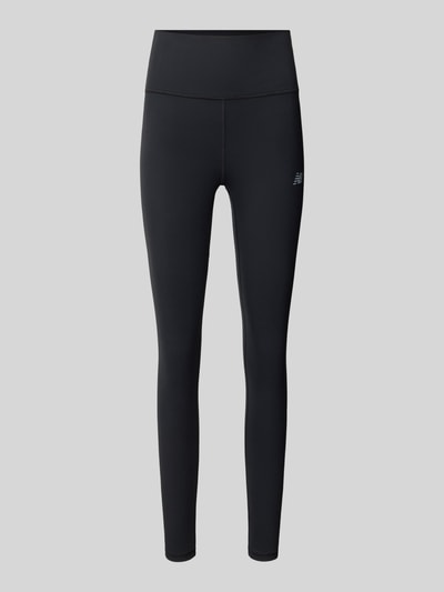 Produktfoto, schwarze Jersey-Slim Fit Leggings mit Logo-Print von New Balance, Modell 'Harmony', elastischer Bund, glatte Textur
