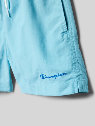 Productfoto, lichtblauwe 'Badehose mit Eingrifftaschen und Logo-Print' van CHAMPION, loose fit, elastische tailleband met trekkoord, zijzakken, logo-print