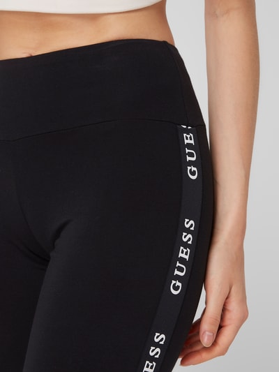 Guess Activewear Legginsy sportowe z paskami z logo model ‘Aline’  Czarny 3