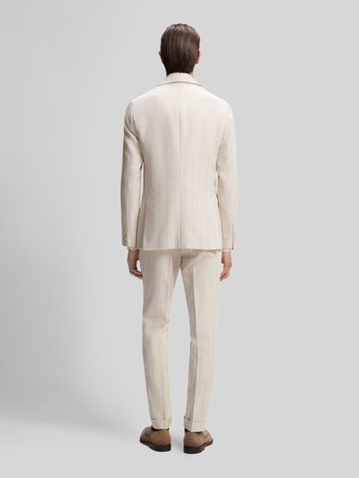 Männermodel trägt Slim Fit Anzug aus Baumwoll-Woll-Mix Modell 'H-HUGE-2PCS-261' von BOSS, Optik:Allover-Muster, Ganzkörperansicht Rückansicht