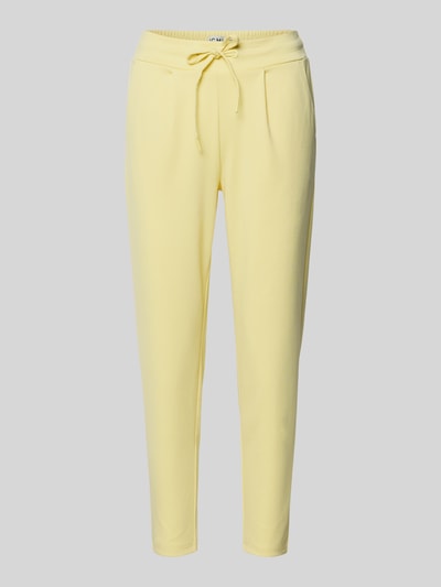 Produktfoto, gelbe Hose mit elastischem Bund, Schnürung und schmalem Bein, Modell 'KATE' von ICHI, Material-Mix mit Viskose-Anteil, Slim-Fit.