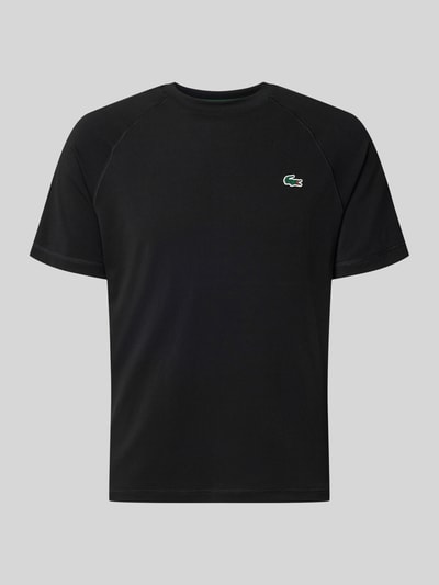 Produktfoto, schwarzes Regular Fit Sport-T-Shirt mit Logo-Detail von Lacoste, glatte Textur, Herren Sport-T-Shirt von Lacoste Sport