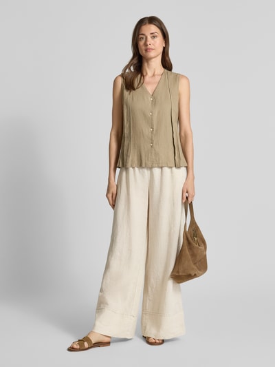Frauenmodel trägt Leinenhose mit elastischem Bund Modell 'FLORA' von Stefanel, Wide-Leg-Fit, Reines Leinen, Kordelzug, Ganzkörperansicht von vorne. Innenbeinlänge 78 cm, Bundweite 36 cm, angedeutete Gesäßleistentasche, Damen Stoffhose.