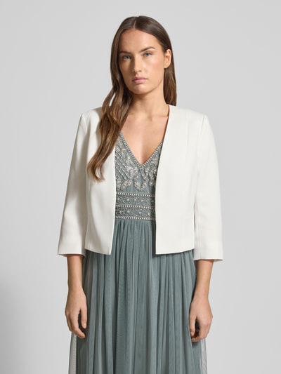 Kobiece modelka nosi Bolerko z rękawem o dł. 1/2 od Christian Berg Cocktail, jednokolorowy, krój tailored, materiał wytrzymały, długość tyłu 46 cm przy rozmiarze 36, widok z przodu na całą sylwetkę.