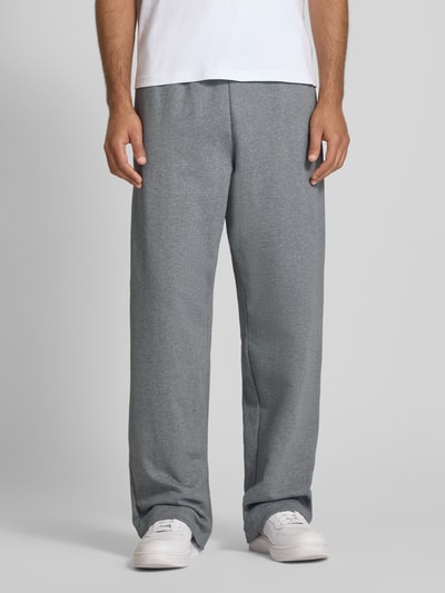 CK Calvin Klein Spodnie dresowe o rozkloszowanym kroju z kieszeniami z tyłu model ‘PREMIUM TERRY’ Średnioszary melanż 4