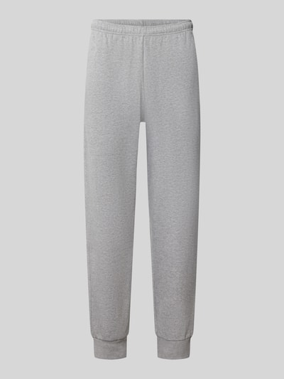Produktfoto, szare spodnie dresowe z mieszanki bawełny, Model 'EVOLUTION' od The North Face, krój relaxed fit, elastyczny pas z tunelem, wpuszczane kieszenie, Długość wewnętrzna nogawki w rozmiarze M: 75 cm