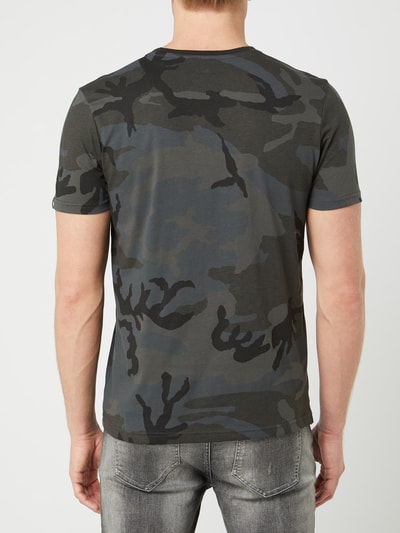 black jeans camo shirt