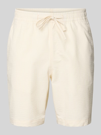 Produktfoto, Loose Fit Shorts aus Baumwoll-Mix von Lacoste, Optik:Allover-Muster, gestreift, Regular-Fit, Seersucker-Struktur, Label-Stitching-Applikation, Bundabschluss: elastisch mit Tunnelzug, seitliche Eingrifftaschen, Materialverarbeitung: Baumwoll-Mix, helle Cremefarben, leichte strukturierte Oberfläche.