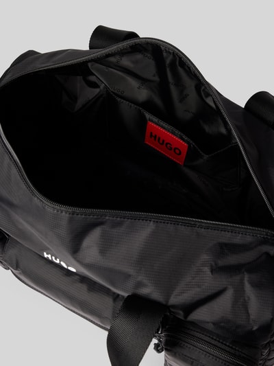 Produktfoto, Weekender mit Reißverschlusstaschen Modell 'EVERETT' von HUGO in Schwarz mit Logo Print, strukturierte Oberfläche, Innenansicht