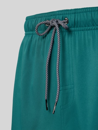 Produktfoto, Badehose mit Seitentaschen und Klettverschlusstasche hinten von PUMA in Türkis mit elastischem Bund und feiner Struktur