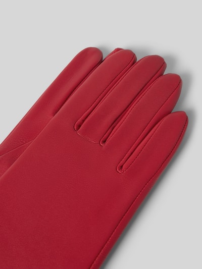 Produktfoto, Handschuhe aus Nappaleder mit Fleecefutter von Roeckl in kräftigem Rot, glatte Textur, Fingerhandschuhe, Label-Detail sichtbar.