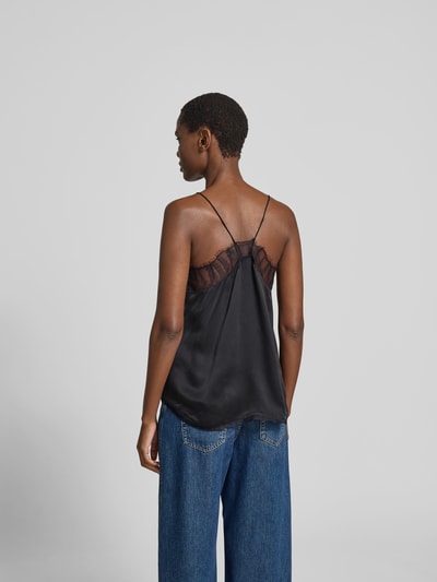 Frauenmodel trägt Top mit Spitzenbesatz von Iro in Schwarz mit Spaghetti-Trägern, Relaxed-Fit, semitransparente Partien, Ganzkörperansicht Rückansicht. Rückenlänge bei Größe 36: 46 cm.