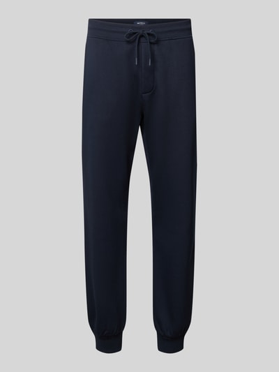 Produktfoto, dunkelblaue Straight Fit Jogginghose aus Baumwoll-Mix von MCNEAL mit elastischen Abschlüssen und Eingrifftaschen, neutrale glatte Textur