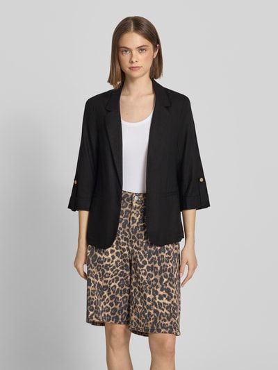 Frauenmodel trägt Relaxed Fit Blazer aus Viskose-Leinen-Mix Modell 'GOA' von Only, unifarben, mit Reverskragen, Ganzkörperansicht von vorne.