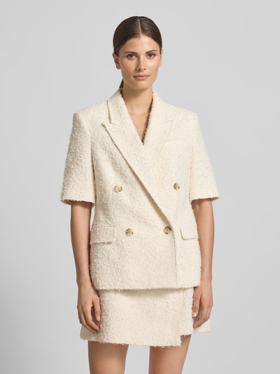Vrouwenmodel draagt Regular Fit blazer uit katoenmix model 'JALETO11' van BOSS, look: effen, korte mouw, dubbele knoopsluiting, reverskraag, met klepzakken, materiaal: katoenmix, voorkant full-body opname.