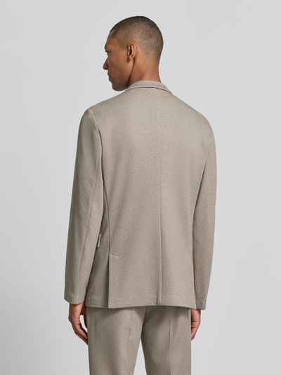 Männermodel trägt Super Slim Fit Sakko mit Viskose-Anteil model 'Anton263X-H' van HUGO in beige met fijne textuur, Ganzkörperansicht Rückansicht.