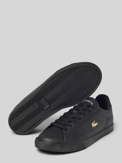 Productfoto, zwarte sneakers van echt leer met gouden logo, eenvoudig design en fijne structuur, Sneaker uit echt leer model 'LEROND SET' van Lacoste, Heren sneakers