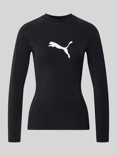 Produktfoto, Badeshirt im langärmeligen Design Modell 'RASH GUARD' von PUMA, mieszanka materiałów z dodatkiem streczu, prosty krój, okrągły dekolt, nadruk z logo, uv-protection 50+, odporne na chlor, długość tyłu w rozmiarze S: 56 cm, kolor czarny z białym nadrukiem