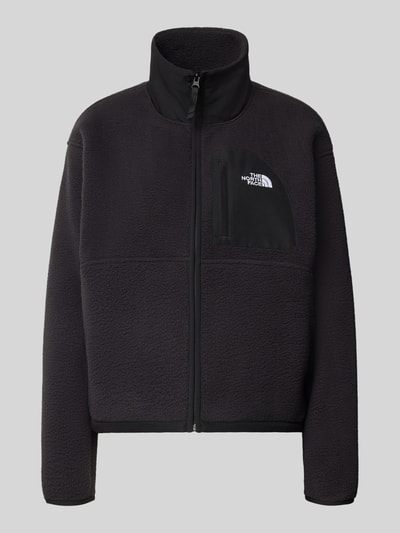 Produktfoto, czarna kurtka z polaru Regular Fit Fleecejacke mit Stehkragen Modell 'YUMIORI' von The North Face, krój regular fit, wyhaftowane logo, zamek błyskawiczny, materiał o miękkiej strukturze, długość tyłu w rozmiarze S: 58 cm, szerokość ramion w rozmiarze S: 52 cm, szerokość w rozmiarze S: 58 cm, długość rękawów w rozmiarze S: 57 cm