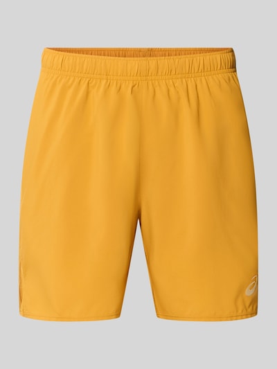 Productfoto, Regular Fit Shorts met geïntegreerde slip Model 'Core' van ASICS TIGER, gele kleur, logoprint, elastische band, Heren, bandwijdte maat M 38 cm, binnenbeenlengte 17 cm