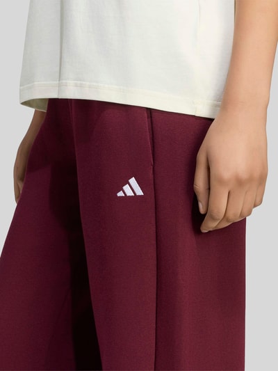 adidas Sportswear Spodnie dresowe o kroju regular fit z mieszanki bawełny model 'W SL FC PT' Bordowy 3