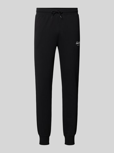 Produktfoto, schwarze Sweatpants mit Label-Print Modell 'GORDON' von JACK & JONES, lockere Passform, elastischer Bund, seitliche Eingrifftaschen, schlichte Textur