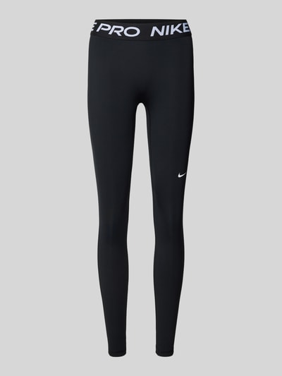 Produktfoto, Leggings mit Logo und elastischem Bund von NIKE TRAINING, schwarzer Material-Mix mit Stretch-Anteil, körpernahe Passform