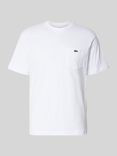 Produktfoto, Regular Fit T-Shirt aus reiner Baumwolle von Lacoste in Unifarbe Weiß mit Rundhalsausschnitt und Logo-Stitching auf der Brusttasche