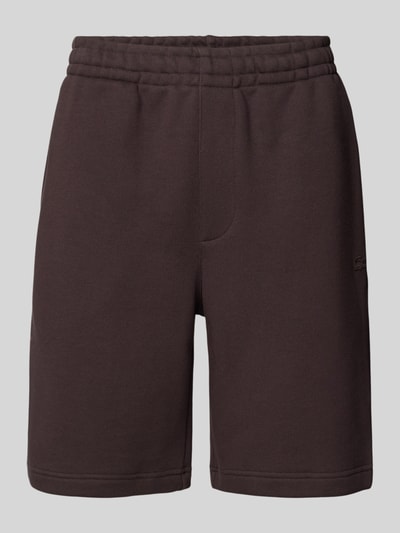 Produktfoto, Relaxed Fit Sweatshorts aus reiner Baumwolle von Lacoste in einfarbigem Dunkelbraun, elastischer Bund, Seitentaschen, Sweat-Textur.