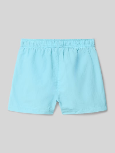 Productfoto, lichtblauwe Badehose mit Eingrifftaschen und Logo-Print van CHAMPION, loose fit, elastische tailleband met koord, zijzakken, logo.