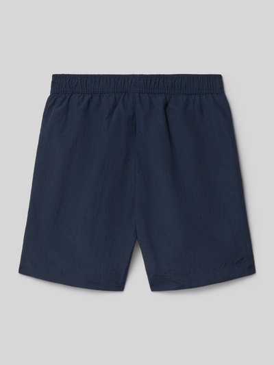 Produktfoto, donkerblauwe zwembroek met elastische band, loose fit, zij-steekzakken en logoprint, Badehose mit Eingrifftaschen und Logo-Print van CHAMPION