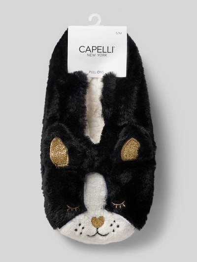 Produktfoto, Kuschelsocken mit Zier-Applikationen und Noppen von CAPELLI NEW YORK, schwarz-weiß mit goldfarbenen Details, weiche Plüschtextur, Damen Kuschelsocken Pull-Ons