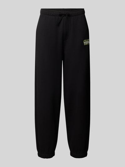 Produktfoto, schwarze Regular Fit Sweathose aus reiner Baumwolle Modell 'Nivion' von HUGO, Herren Sweathose von HUGO Blue, grauer Hintergrund