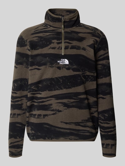 Produktfoto, Fleecepullover mit Troyer-Kragen von The North Face in Braun mit schwarzen Mustern, lockere Passform, Fleece-Textur