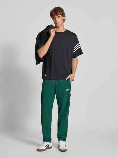 adidas Originals Spodnie dresowe z elastycznym ściągaczem Ciemnozielony 1