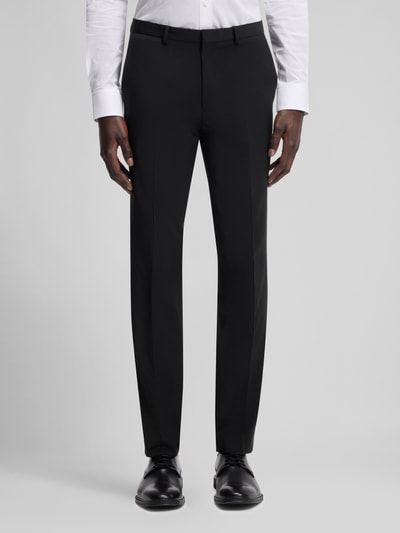 Männermodel trägt Slim Fit Anzughose aus woll-mix Modell 'HESTEN' van HUGO, uni, melange look, persbroeken, zijzakken, vooraanzicht, context Herren Anzughose.
