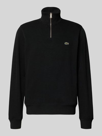 Produktfoto, Regular Fit Troyer aus reiner Baumwolle von Lacoste in Schwarz, grobe Textur, silberner Zipper, dezentes Logo auf Brust