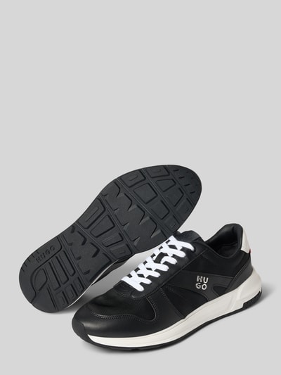 Produktfoto, Sneaker mit Label-Datei Modell 'GO3_nypu' von HUGO in Schwarz mit weißen Schnürsenkeln und strukturierter Gummisohle, Herren Sneaker von HUGO