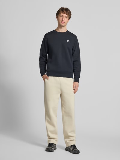 Nike Sweatpants mit Logo-Stitching und Eingrifftaschen Beige 1