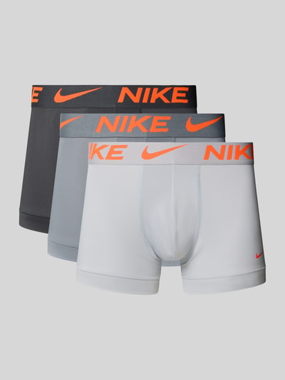 Produktfoto, Micro Trunks im 3er-Pack mit Logo-Bund von Nike für Herren, Material-Mix mit Stretch-Anteil, Körpernaher-Schnitt, Elastischer-Logo-Bund, Logo-Print, 3er-Pack, in Grau- und Weißtönen mit orangem Logo-Bund.